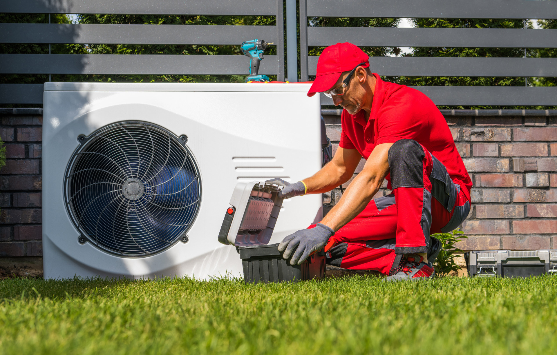 Technician installing a heat pump